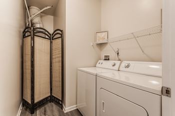 A laundry room with a washer and dryer.